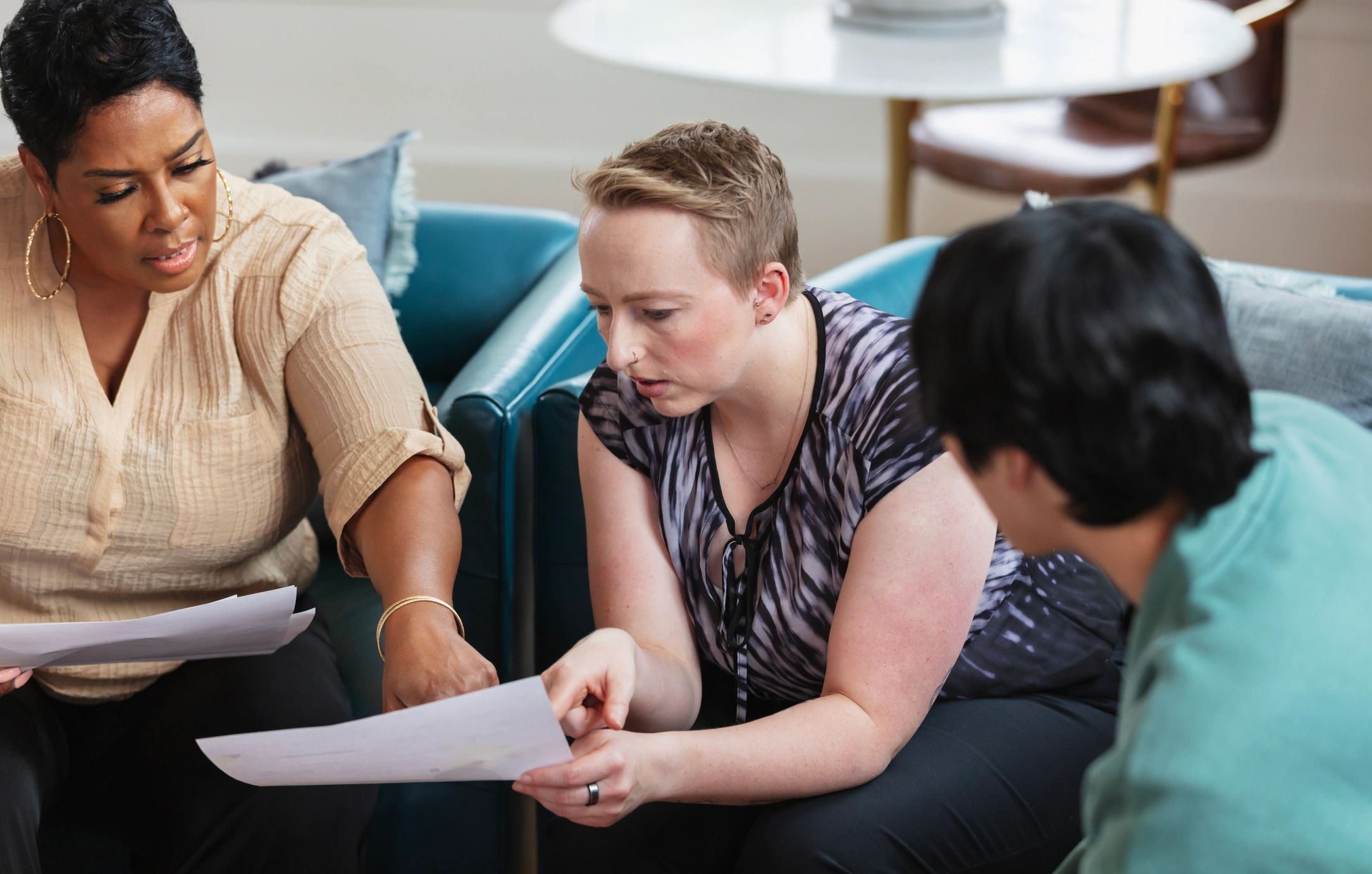 Small group in discussion around a document